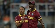 Samuel Badree and Darren Sammy celebrate Jason Roy's wicket in the 2016 World Cup final.